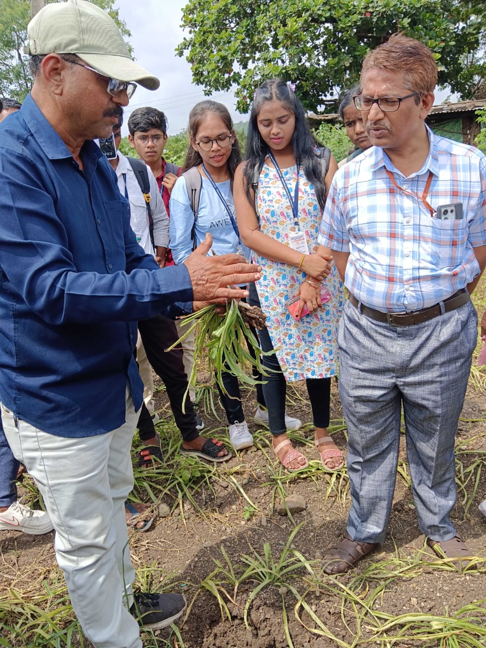 Mr. Ravi Anokar giving information to students in the field