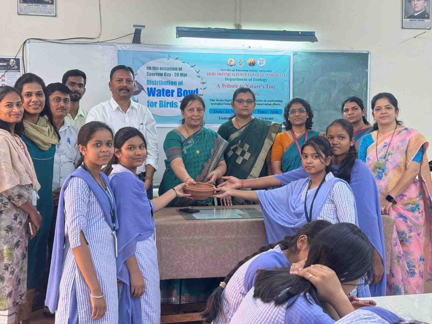 Distribution of water bowls by Prof . J.D. Dhote