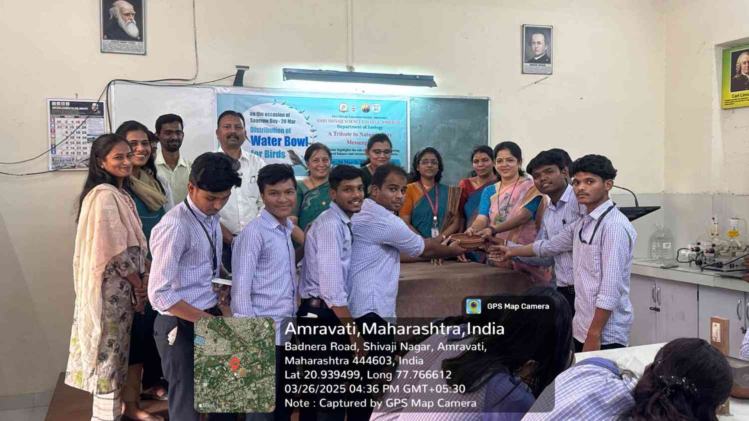Students receiving water bowls for sparrow conservation.