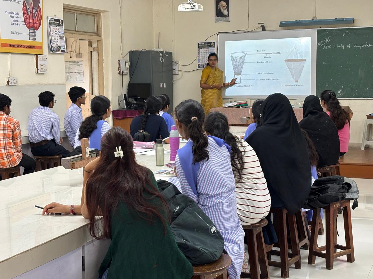 Dr. S. V. Gawande explaining the study of zooplankton to students