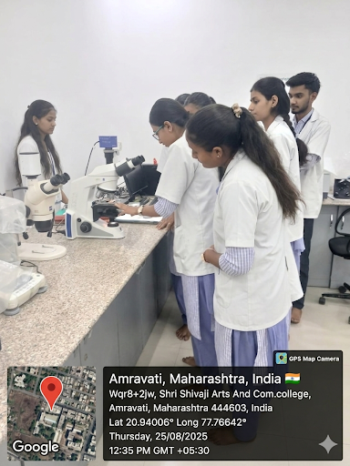 Students learning alignment and focusing techniques of the microscope.