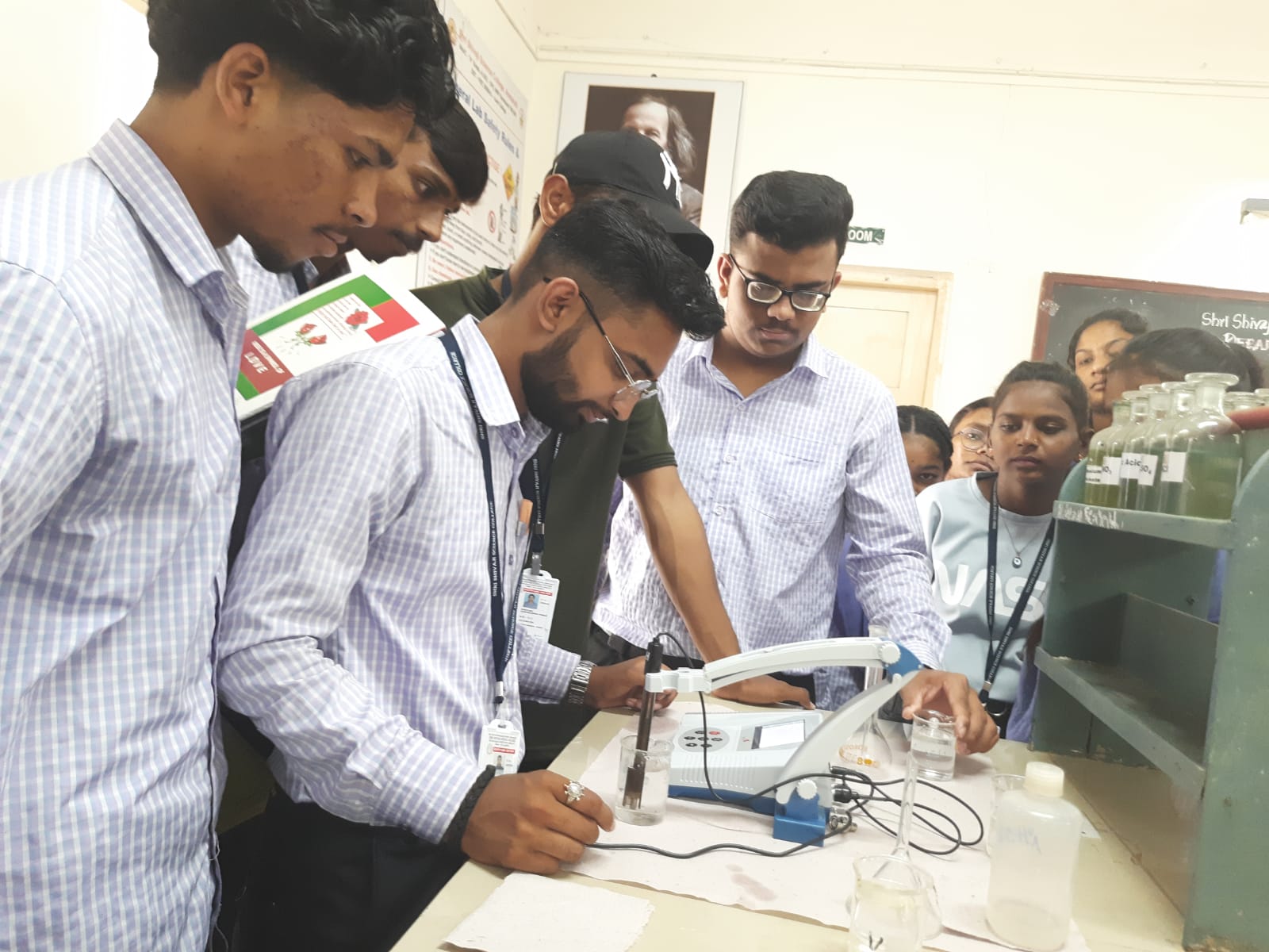 Students performing pH measurement of borewell water sample