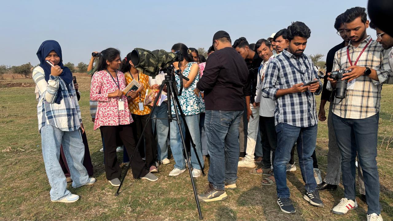 Students noting down the cited birds name in their notebook.