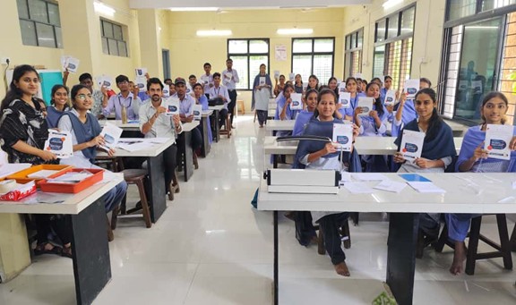Students showing Hand made Notepads 