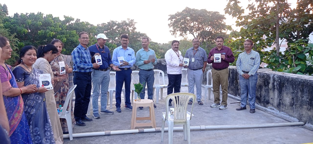 Principal and faculty members displaying the results of Paper Rebirth hands-on workshop